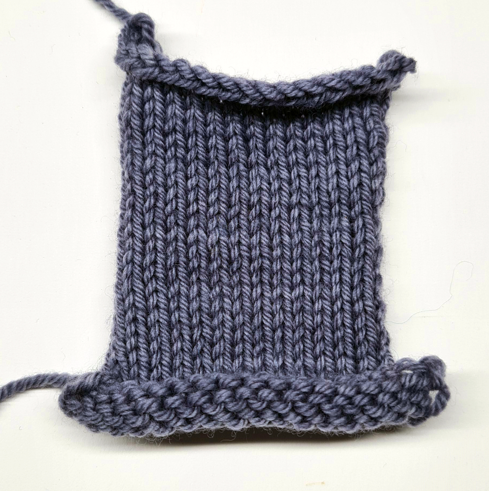 knitted square swatch grey, edges curl
